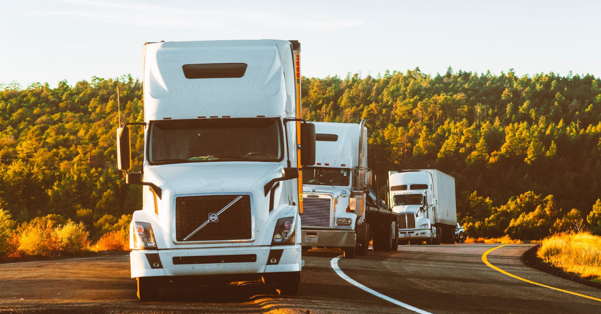 trucks driving on road