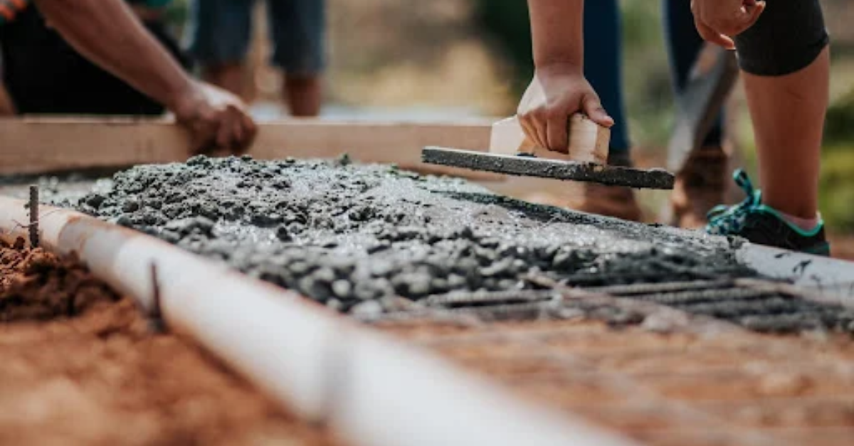construction workers laying cement