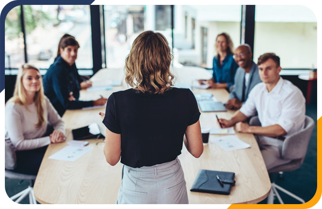 Professional giving a presentation in a board room