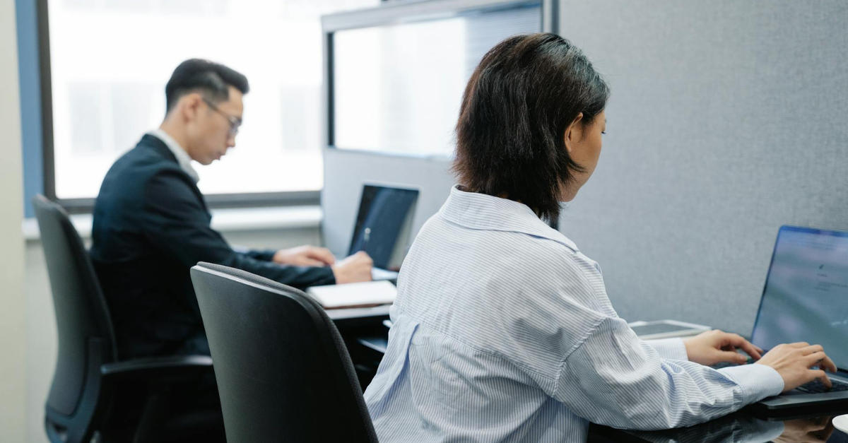Man and woman using laptop