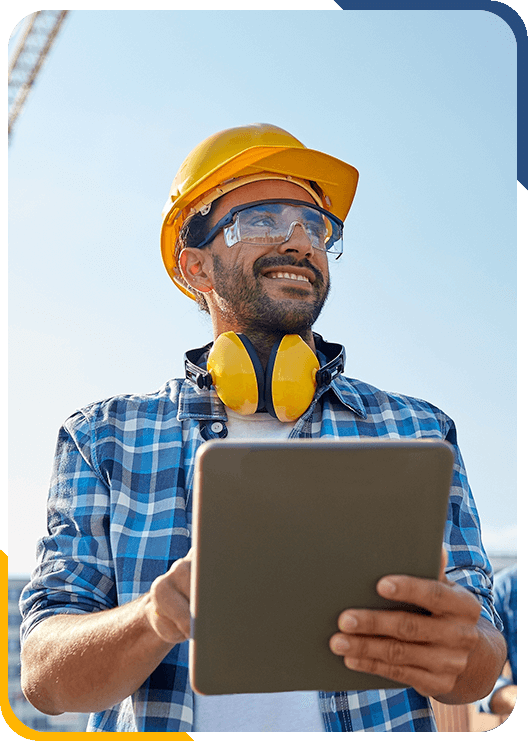 Construction worker handling administrative functions out in the field