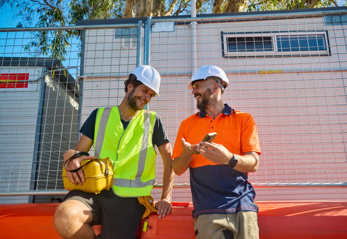 workers wear PPE leaving jobsite