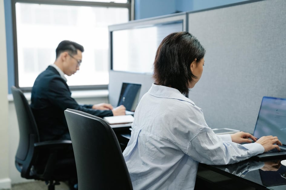 Man and woman using laptop